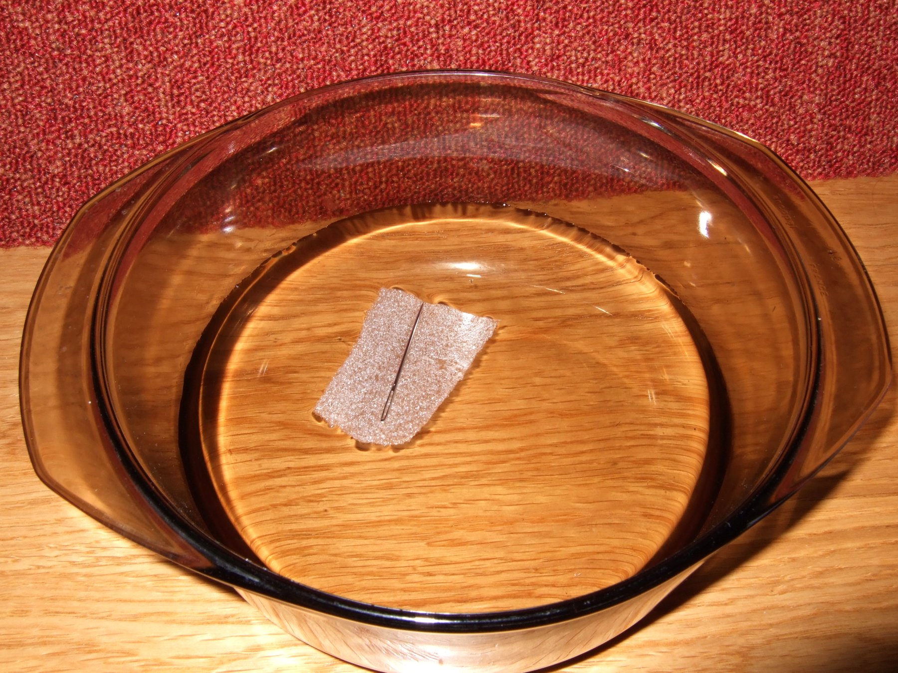 The compass is formed by floating the magnetised needle in the centre of the bowl