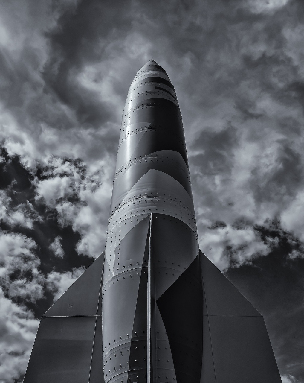 a greyscale image of a large rocket