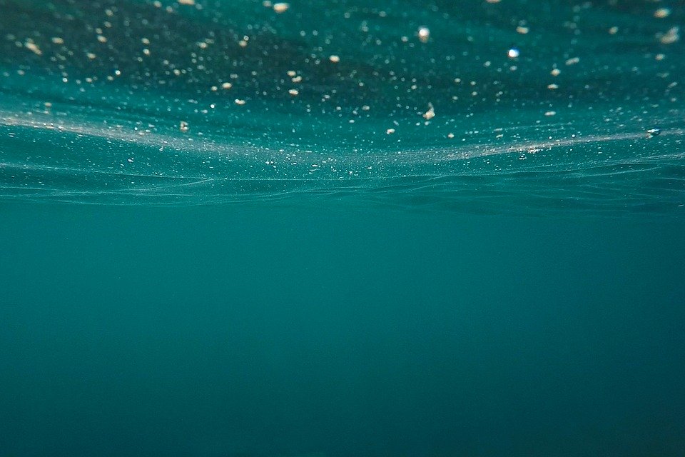 An underwater view of the ocean surface.