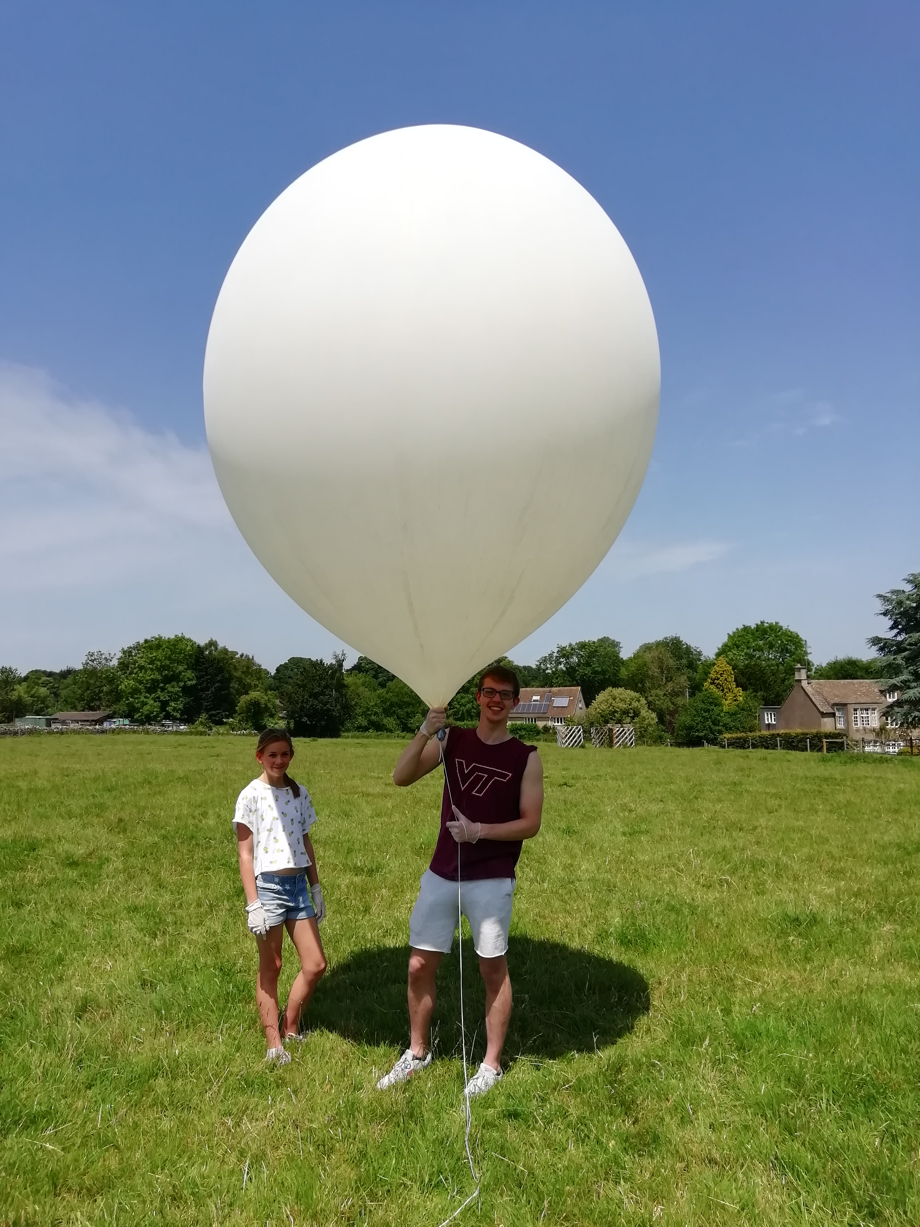 Amelia and Matthew are given the job of hanging onto the inflated balloon until we were ready to launch