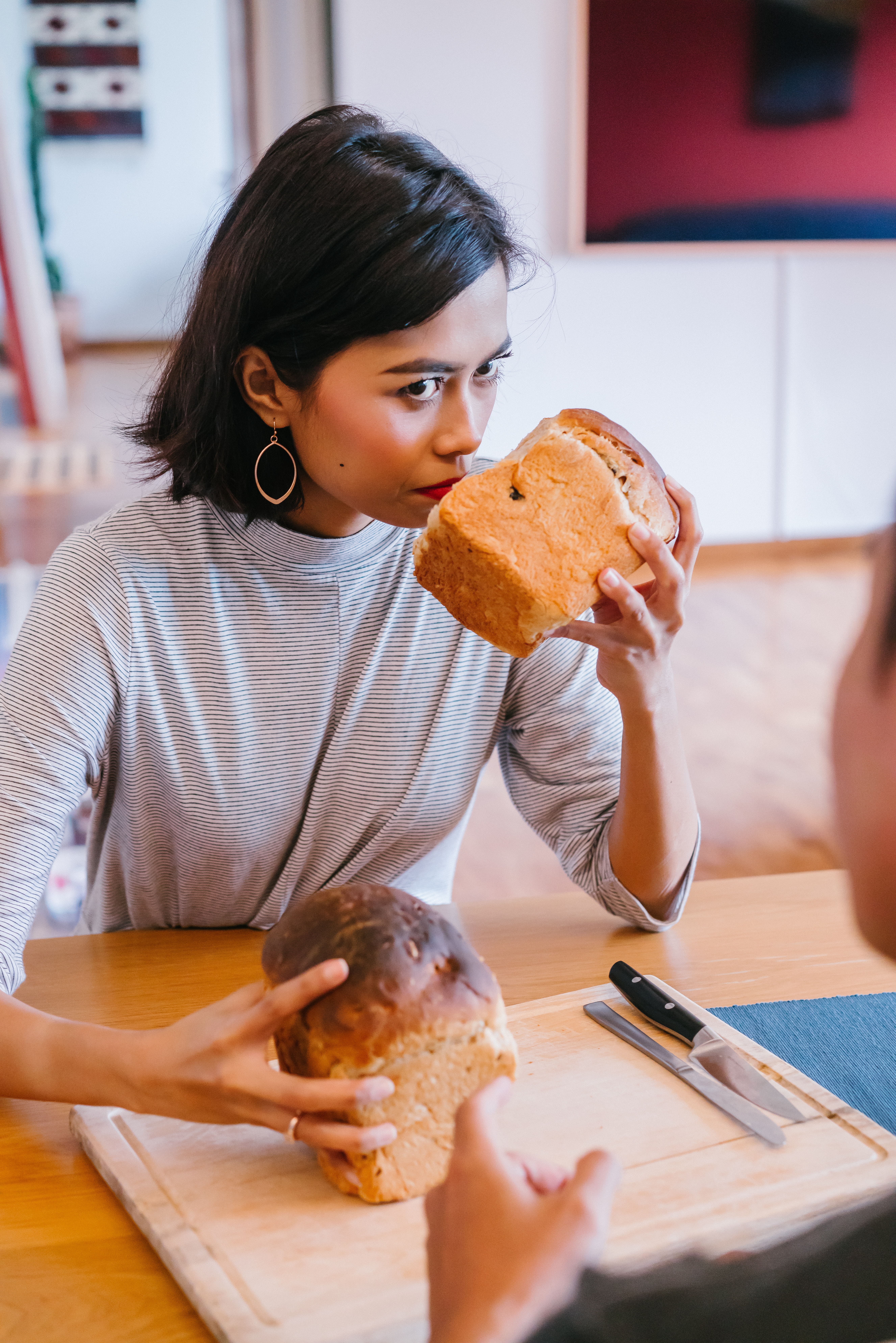 A woman smelling bread