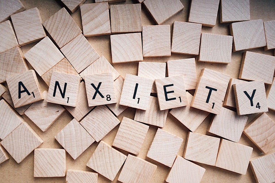 The word 'anxiety' spelled out in scrabble tiles.