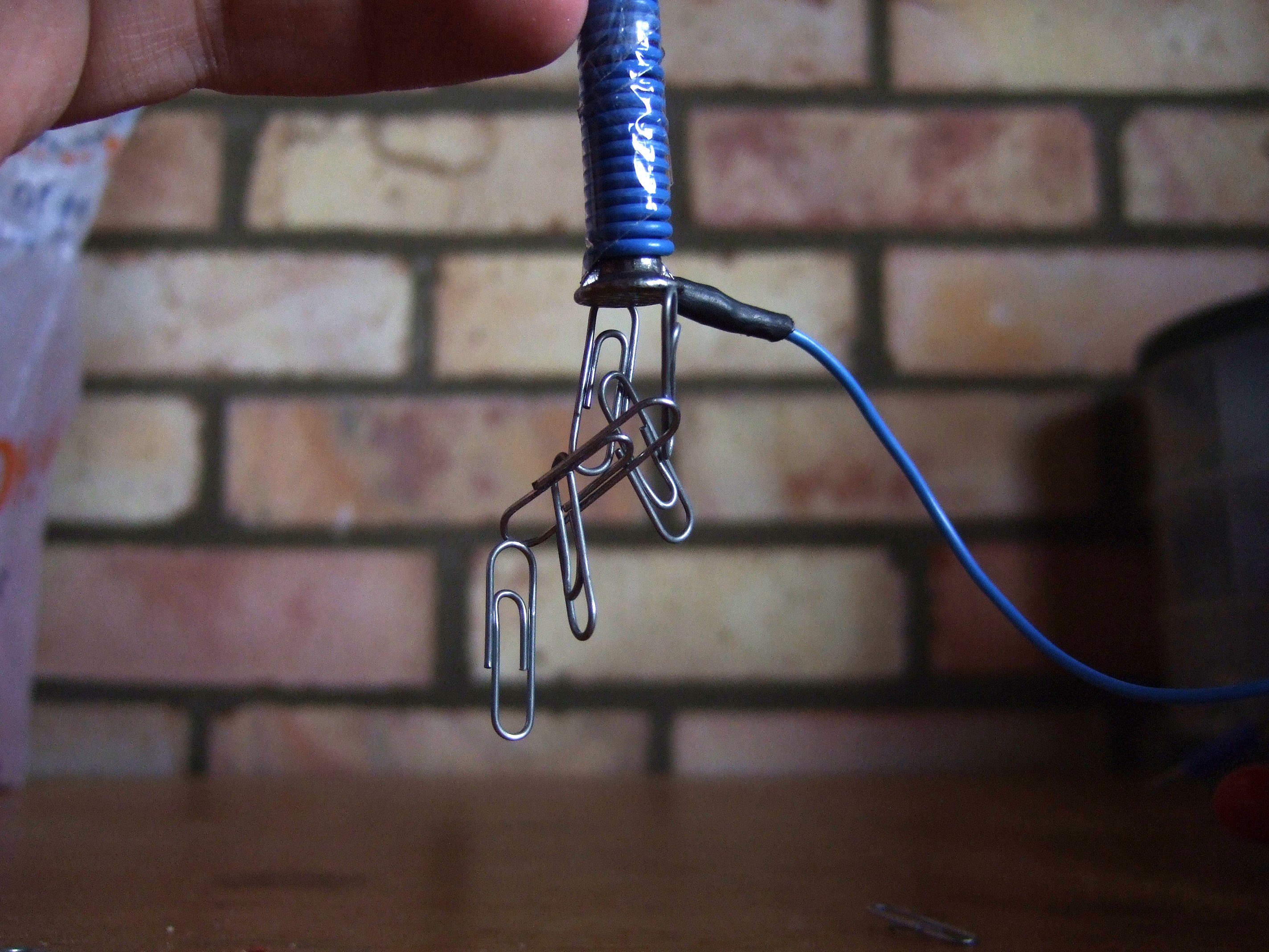 When the electromagnet is on it will pick up paperclips