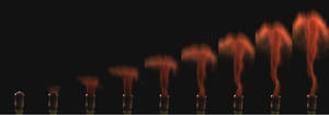 顺序仍然从一个视频帧拍摄10,000fps. Each frame is 1/10,000 of a second. The mushroom cloud with a trailing wake is clearly visible.
