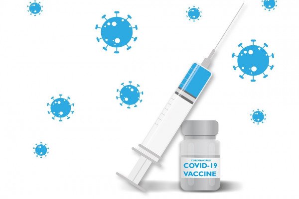 一根针和一瓶COVID-19疫苗。