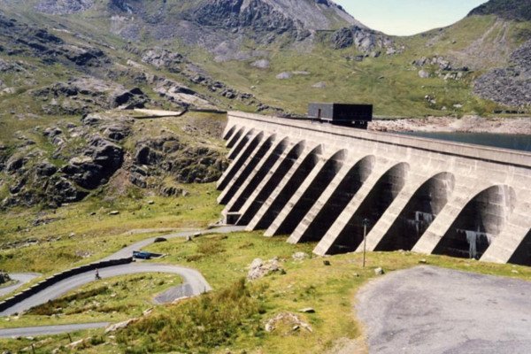 The upper reservoir (Llyn Stwlan) and dam of the Ffestiniog Pumped Storage Scheme in north Wales. The four water turbines at the power station can generate 360 MW of electricity within 60 seconds of the need arising.