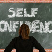 Self confidence written on a blackboard