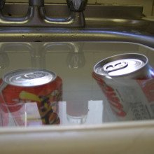 The diet drink will float, but the sugary drink sinks